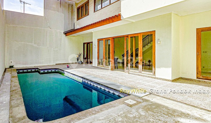 For Sale Quick Negotiable Price Well Below Market Minimalist House in Townhouse with Pool, Family Room, 4+ Bedrooms, Maid's Room, 2 Car Garages plus 1 Carport, Safe and Comfortable in Lebak Bulus, South Jakarta.