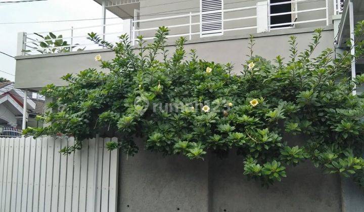 Rumah Griya Loka Huk Dengan Rooftop Siap Huni  2