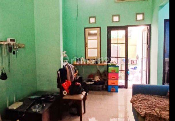 Rumah Bagus Murah Rapi Siap Huni di Graha Raya  1