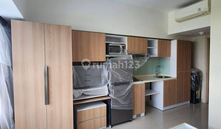 APARTEMEN TIPE STUDIO DI MENARA ELODEA, THE SPRINGLAKE VIEW, FURNISHED BAGUS, VIEW KOLAM RENANG DAN LANTAI RENDAH 1