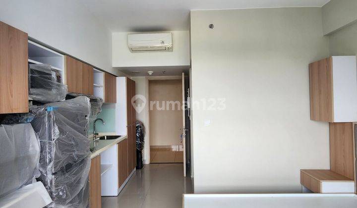 APARTEMEN TIPE STUDIO DI MENARA ELODEA, THE SPRINGLAKE VIEW, FURNISHED BAGUS, VIEW KOLAM RENANG DAN LANTAI RENDAH 2