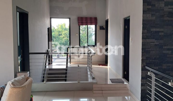 COMFORTABLE AND PEACEFUL RESIDENCE WITH STRATEGIC LAKE VIEW IN CIBUBUR 2