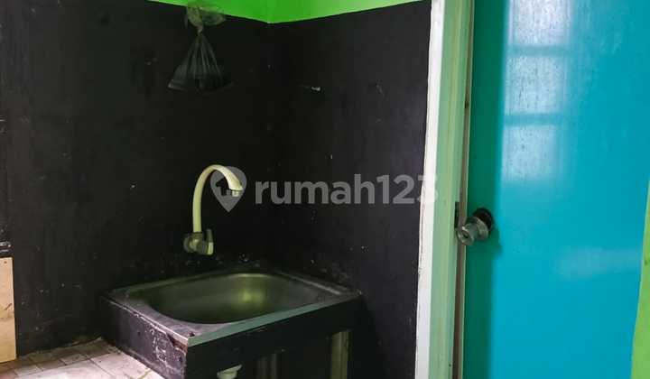 For Quick Sale: House with 16-Door Shop and Rental Units in Cinangka, Depok 2