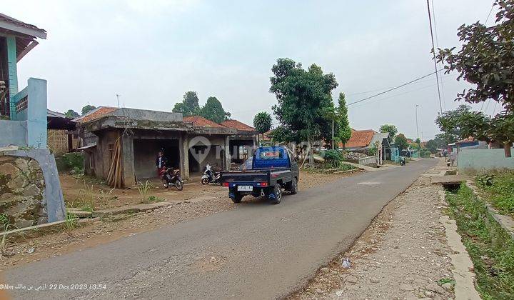 Tanah MURAH berikut bangunan pinggir jalan besar strategis 1