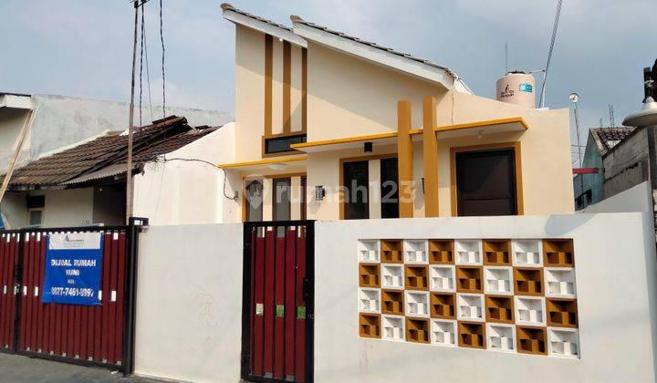 Dijual Rumah Lantai Granit, Atap Baja Ringan, Kusen Aluminium  1