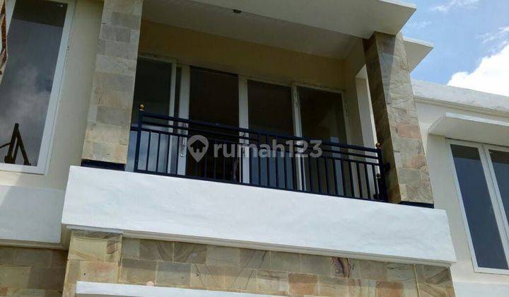 (24). The two-story house is equipped with a garden and living room  1