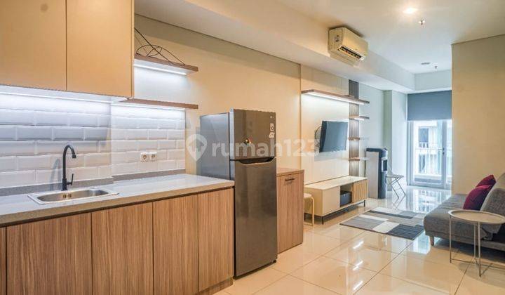 tampak depan sewa apartment the aspen peak