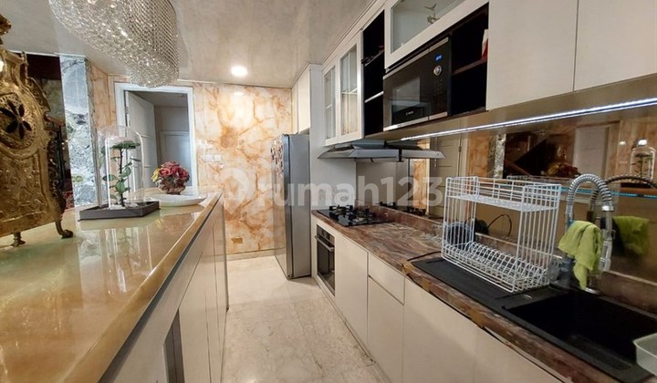 For Sale: Modern Classic Luxury 2-Story Condominium in The Masterpiece Epicentrum - Private Elevator, Near Epicentrum Walk CBD Kuningan, Facilities Include Swimming Pool, Fitness Center, Jogging Track, Garden, Children's Playground, 24-Hour Security & CCTV. 2