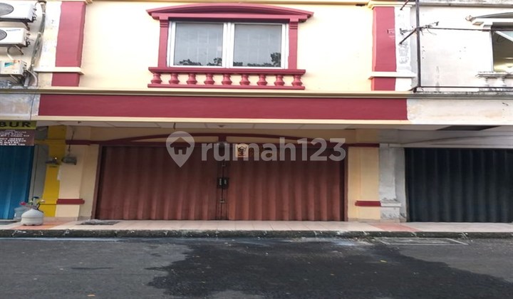 Strategic 2-Story Unfurnished Shop House for Rent in Ruko Taman Surya 5, Access to Soekarno-Hatta Airport, Daan Mogot Mall, Toll Gate, Transjakarta, Facilities: Minimarket, One Gate System, Jogging Track
