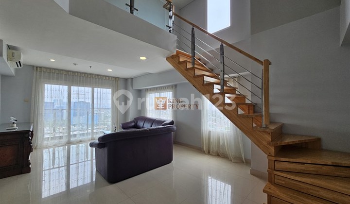 Near Puri Indah Mall & Siloam Hospital, 2nd Floor Unit for Rent Semi-Furnished at Maqna Residence, Strategically Located in a Business Park Environment with Indoor Swimming Pool, Sky Terrace, Fitness Center Facilities.