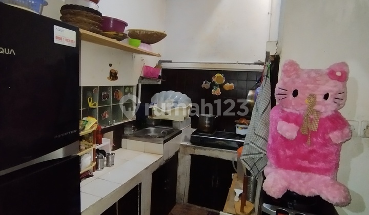 Rumah Asri dan Artistik dengan Nuansa Kayu di Cicukang 2