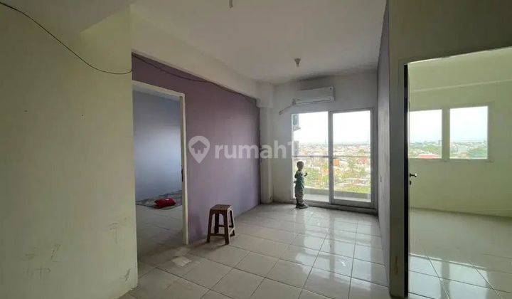 2 BR • 56 m2 Apartemen Puncak Dharmahusada Pool View 1