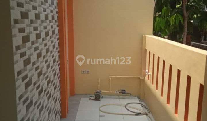 Rumah kuning dalam komplek di Bougenville Marakas  2