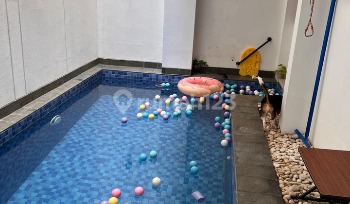 English translation: "For Sale Minimalist House with a Villa Vibe in Kelapa Gading, Near MKG Swimming Pool"