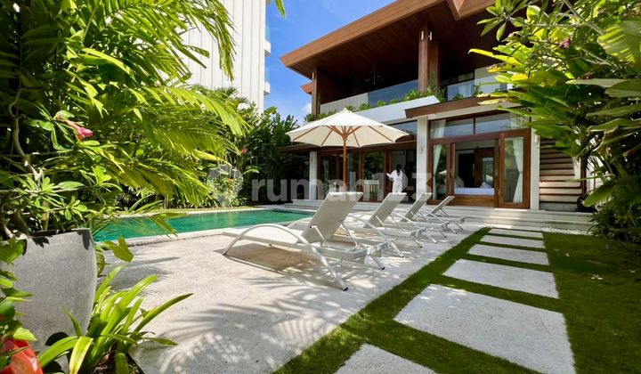 This luxurious 4-bedroom villa, just 60 meters from Cemagi Beach, offers stunning ocean and rice field views, a private pool, spacious living areas, and exclusive amenities, available for both long-term rental or purchase.