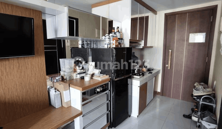 Ready-to-Occupy Gading Serpong Apartment in a Strategic Location