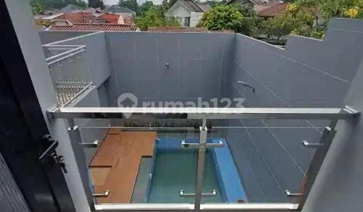 Rumah  di jual  modern 2 lantai dengan kolam renang  2