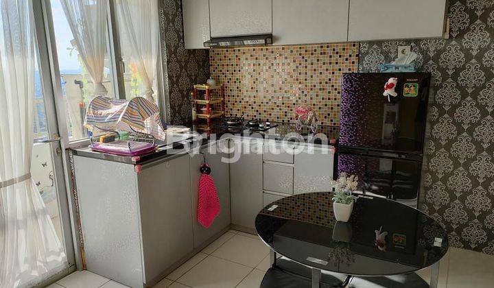 apartemen full furnish educity 2KT hadap kolam angsa 2