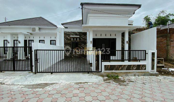 RUMAH CANTIK DI CLUSTER MODERN DEKAT SMP 3 NGAGLIK 1