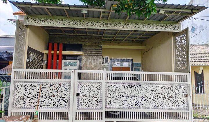 Rumah Modern di Taman Pondok Jati Geluran , Sidoarjo 1