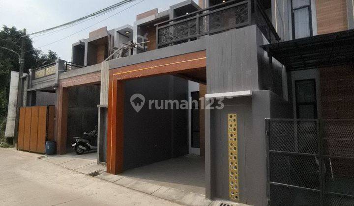 jual rumah modern 2 lantai ada rooftop nya 1