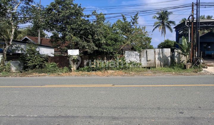 Land on the Side of the Main Road at Kilometer 15