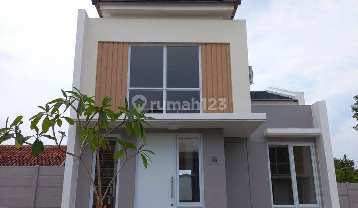 Rumah Modern Minimalist Dengan Mezzanine Cluster Canna Paramount Petals 1