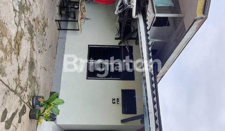 RUMAH DI TENGAH KOTA 