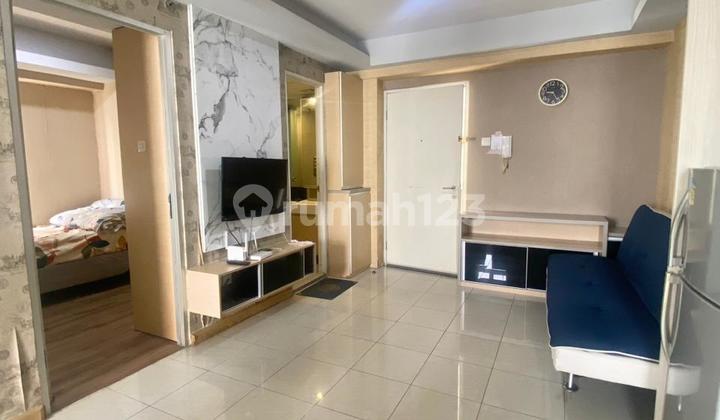 Green Bay Pluit Apartment, originally a 3 BR type, has been renovated into a 2 BR, fully furnished with a view of the pool.