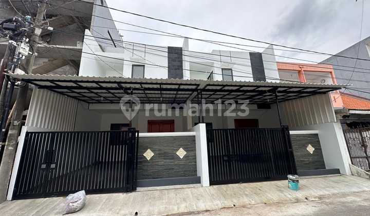 Dijual Rumah baru 2 lantai minimalis di angsoka hijau 5 cengkareng jakbar Lt 6x15 Lb 125 m2 hadap utara Shm, imb, pbb lengkap pam , pln 2200 watt bebas banjir  harga 2,3 m / nego Ada 2 unit