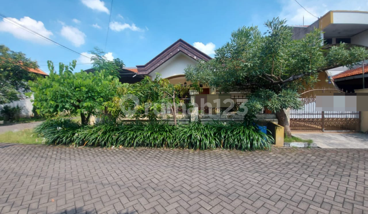 A well-maintained ready-to-occupy house in a beautiful and comfortable environment in Rungkut Asri, Surabaya.