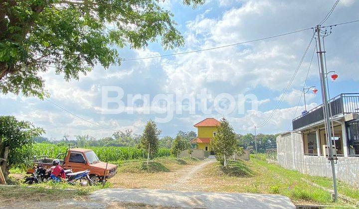 Tanah Dengan Isi Kebun Durian di Pinggir Jalan Utama 2