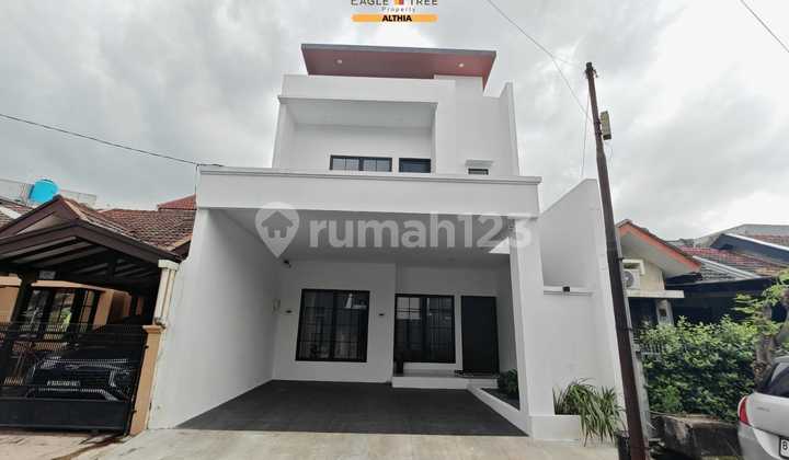 Rumah Baru dengan Furnished Style Modern Tropis di Graha Raya