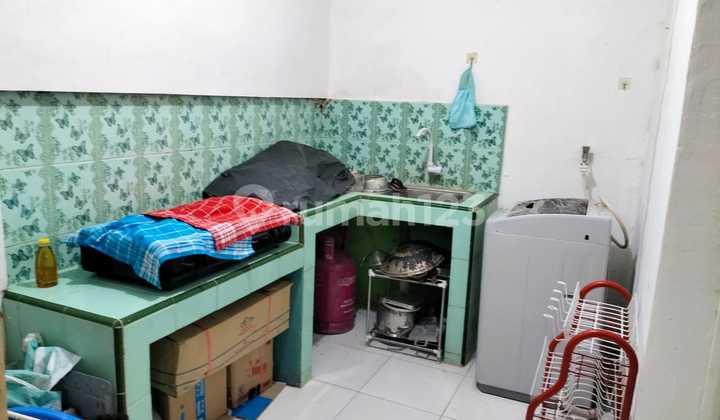 Rumah Asri Depan Lapangan Tenis 2