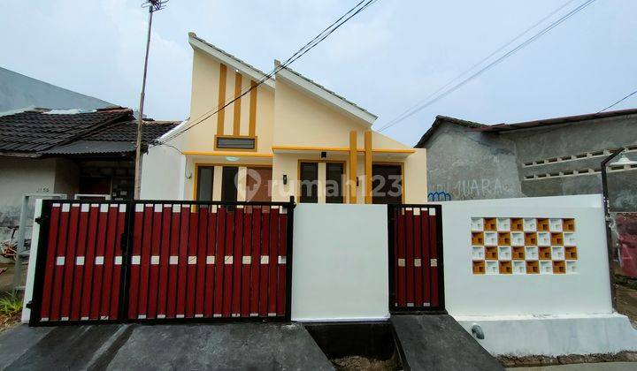 DIJUAL RUMAH DESAIN UNIK LINGKUNGAN ASRI BEBAS BANJIR 1