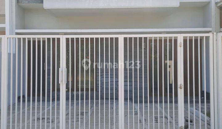 tampak depan dijual via lelang rumah okasi