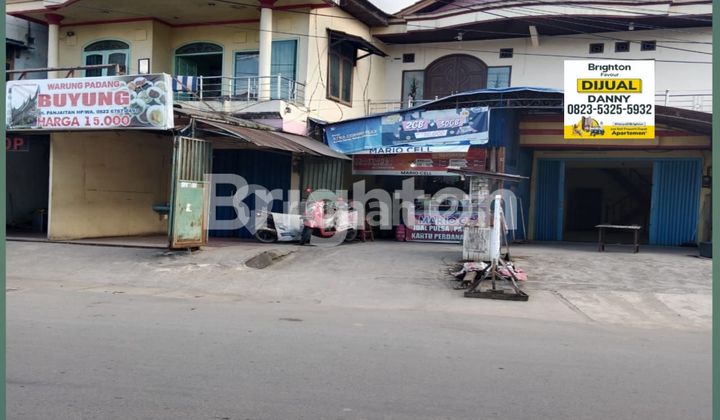 dijual rumah dan toko 4 unit dipinggir jalan di panjaitan