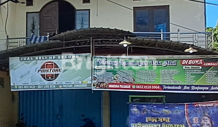 House and shop by the side of a busy road with heavy traffic. On Jalan DI Panjaitan, Samarinda. 1