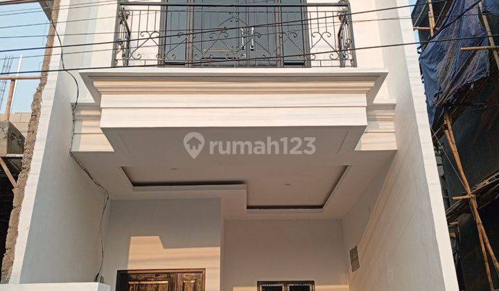 Rumah 2 Lantai + Rooftop, Bata Merah SHM Bebas Banjir Akses Mobil 1