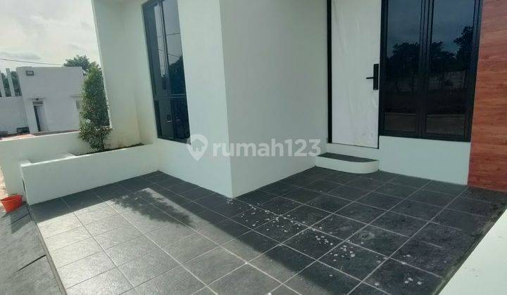 garasi/carport ada rumah 2 lt dkt