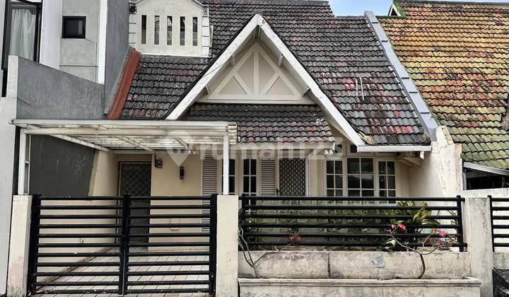 Two-story row house, wide road, and green environment in Lebak Bulus.