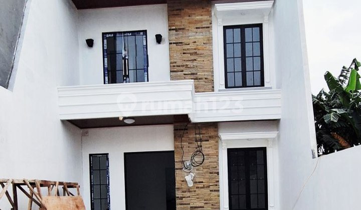 For Sale: Affordable New Classic Luxury 2-Storey House in a Large & Green Housing Complex, Strategically Located Near Jatiwaringin Toll Gate Access, Jatibening Toll Road, LRT, and Bekasi City.