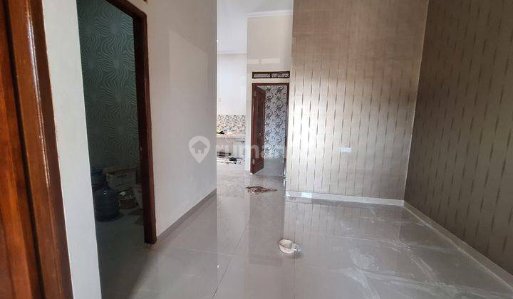 Wilson Rumah baru hadap timur jalan 2 mobil lega di poris 2
