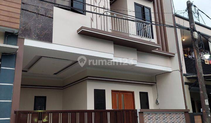 Wilson Rumah baru lokasi bagus 2 lantai di poris indah 1