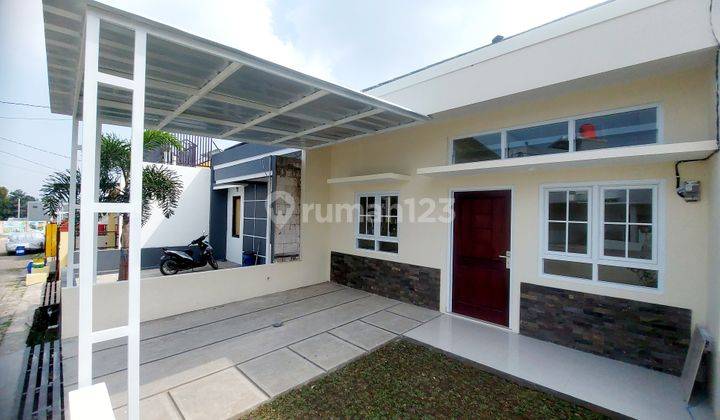 RUMAH BARU ASRI TROPIS DALAM CLUSTER ONEGATE SYSTEM DI CIHANJUANG 1