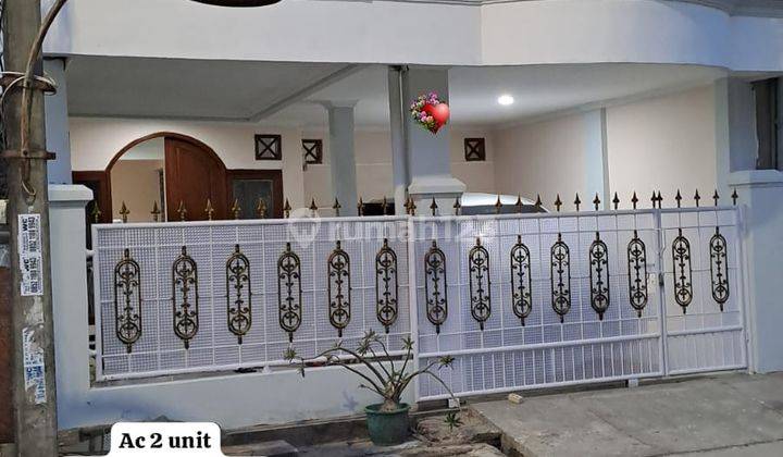 Rumah Mewah Nuansa Gagah di Taman Harapan Baru 22079 Er 1