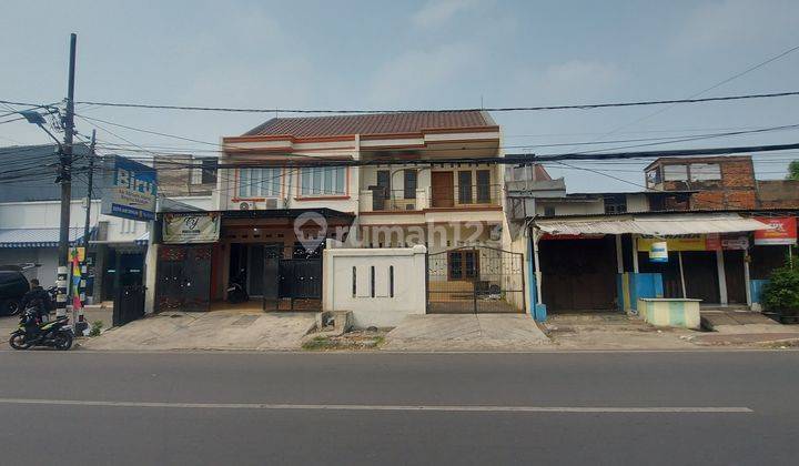 Rumah Pinggir Jalan  Raya ...bisa Untuk Usaha...2 Lantai Butuh Renovasi Shm 1