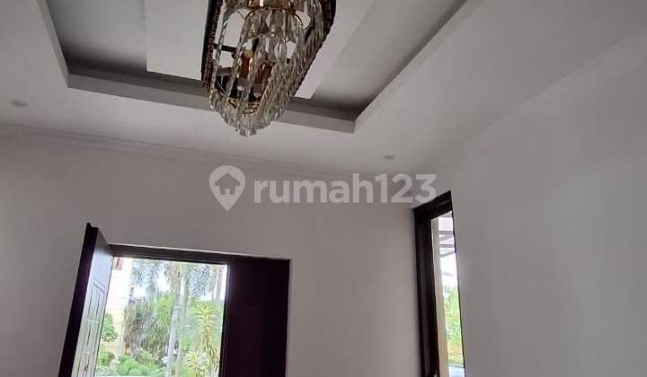 A nice minimalist 2-story house, cheap, in Kota Wisata, land area 128, building area 180. 2