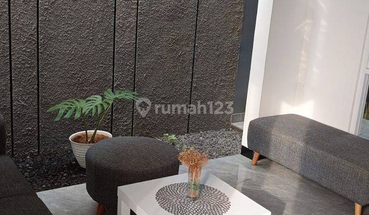 Rumah Modern Nyaman di Taman Holis Indah 1 2