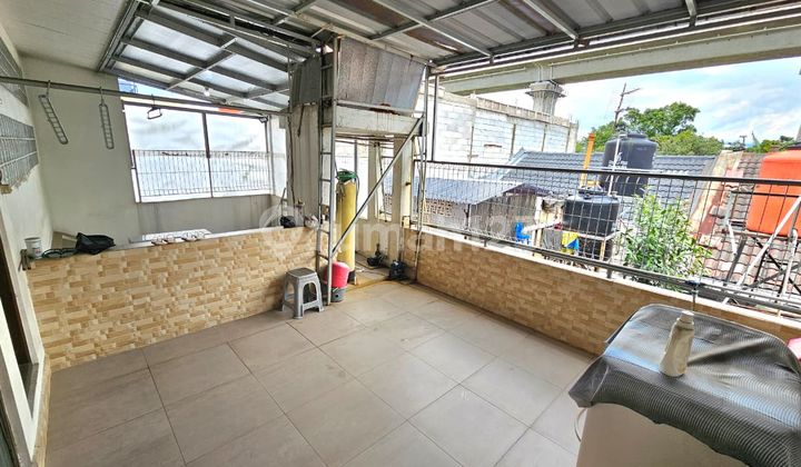 rumah minimalis nyaman di taman holis indah 2